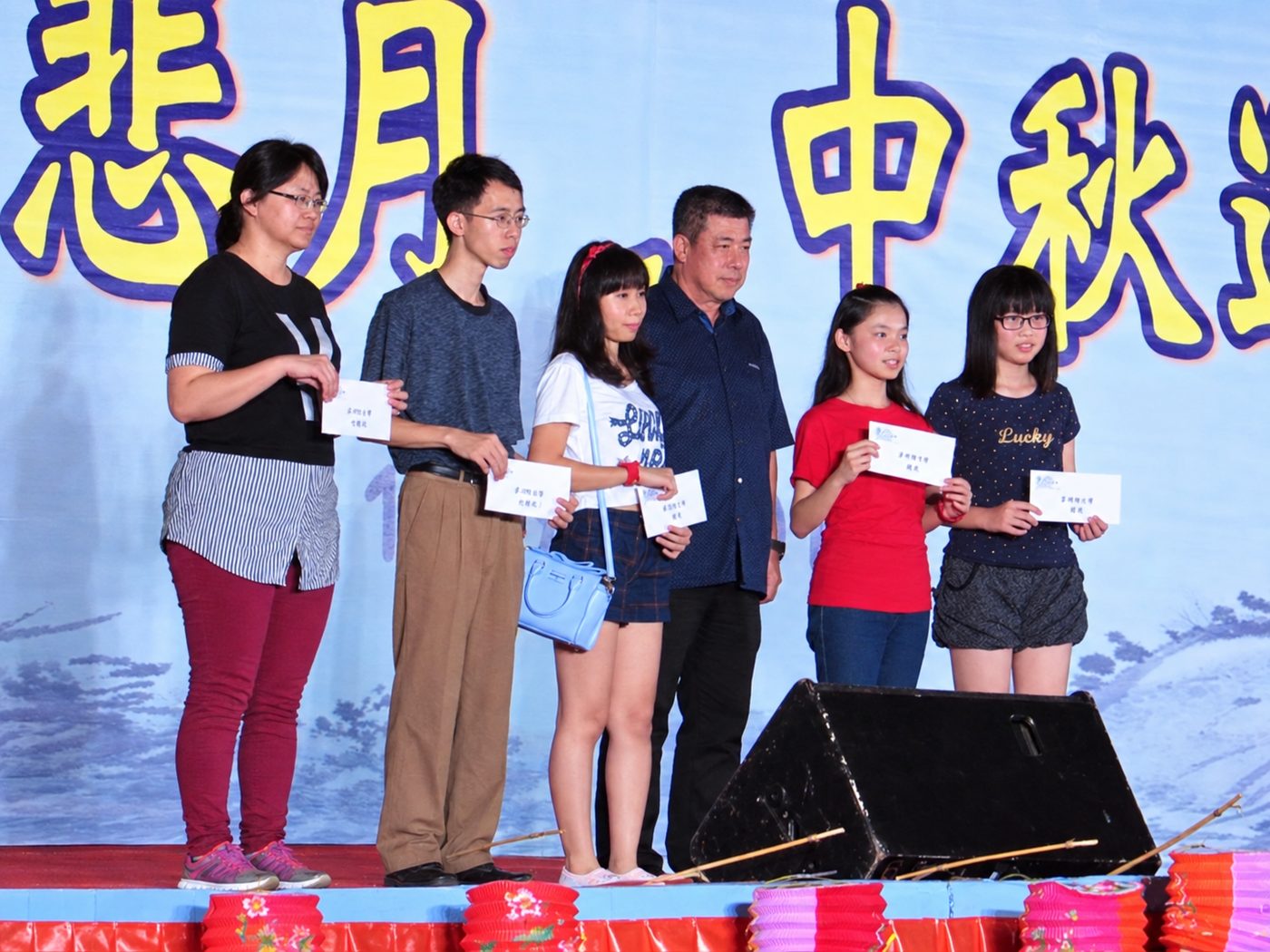 Prize winners receive their awards on stage